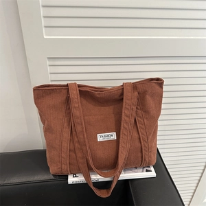Brown corduroy tote bag with dual straps and fashion logo for autumn and winter styles