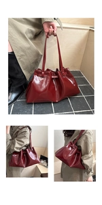 Detailed view of glossy burgundy leather tote bag with drawstring pleated texture