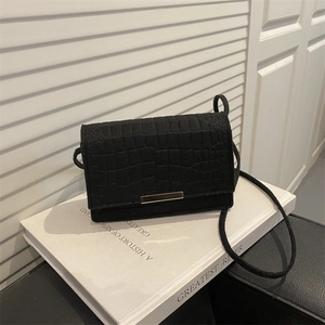 Minimalist black crocodile pattern crossbody bag with gold hardware and long strap