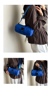 Detailed views of bright blue nylon barrel bag showing crossbody and shoulder carrying modes