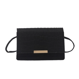Chic black crocodile textured crossbody bag with minimalist gold metal buckle closure