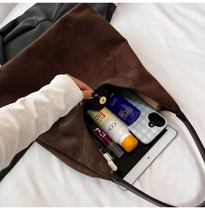 Top view of spacious vintage suede tote bag showing magnetic closure and interior capacity