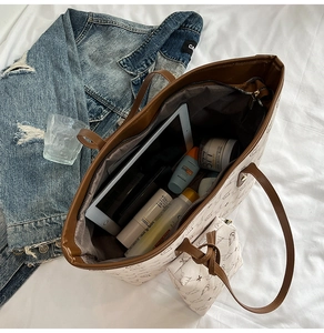 Large capacity printed tote bag interior showing storage for tablets and daily items