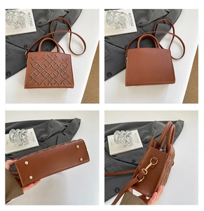 Detailed views of brown embroidered trapezoid bag with metal studs and textured leather