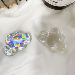 Detail shot of cloud-shaped phone grips in colorful laser and clear transparent resin