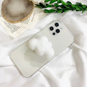 3D cloud shaped phone grip socket on a white smartphone and clear phone case