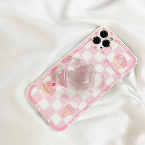 Detailed view of pink checkerboard phone case with transparent bear stand and dessert patterns