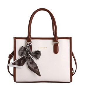 Minimalist snake-pattern white leather tote bag with brown handles and a silk scarf