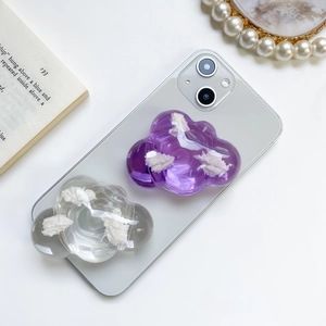 Macro detail of 3D cloud-shaped phone socket stands in transparent and purple resin