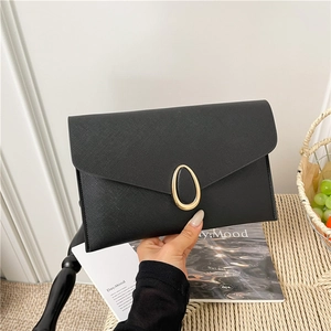 Minimalist black envelope clutch bag with saffiano leather and gold metal lock