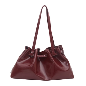 Glossy burgundy patent leather shoulder bag with chic pleated cloud shape and slim straps