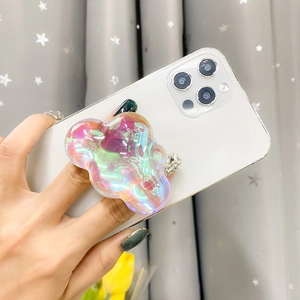 Iridescent cloud-shaped collapsible pop socket phone grip on a white smartphone