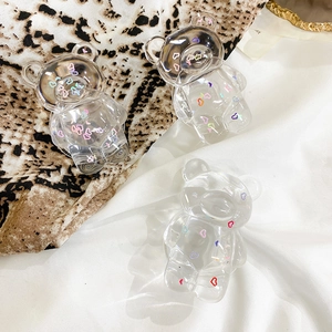 Macro shot of 3 transparent resin bear phone grips with colorful heart pattern detail