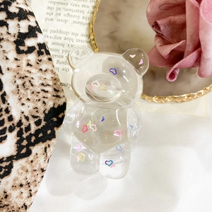 Macro detail of clear resin bear phone socket with colorful heart shaped patterns