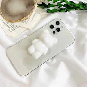 Minimalist 3D white bear phone grip stand on a smartphone with a glossy resin finish