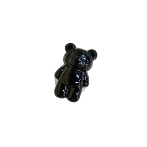 Glossy black bear-shaped phone socket stand with a minimalist 3D design and smooth finish