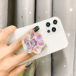 Iridescent cat paw phone socket holder with holographic color-shifting finish on hand