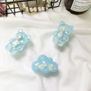 Set di 3 supporti per telefono in resina blu a forma di orso e nuvola su tessuto