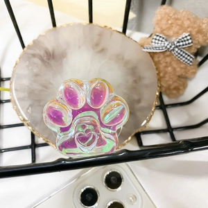 Detailed view of 3D holographic cat paw phone socket with heart relief and purple gradient