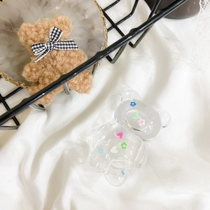Macro view of clear bear phone grip featuring colorful heart and flower sequins inside