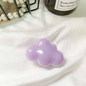 Detailed view of lavender purple cloud-shaped hair clip with glossy resin finish