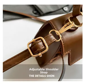 Detail of adjustable PU leather strap with golden metal buckle on leopard print handbag