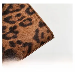 Close-up of leopard print faux fur texture and neat stitching on a vintage shoulder bag