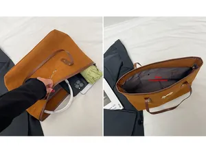 Detail view of large capacity brown suede tote bag interior with golden bow decor