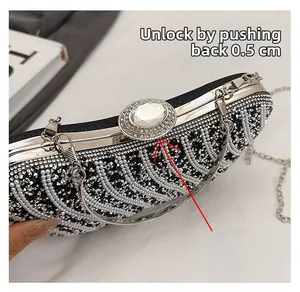 Macro detail of evening bag showing pearl trim and push-back silver clasp mechanism