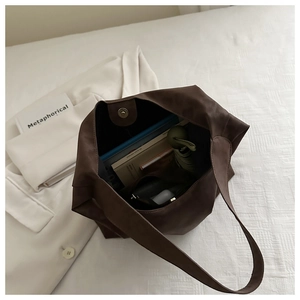 Top view of large capacity brown tote bag with magnetic closure and spacious interior