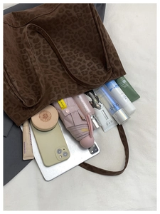 Top view of large leopard print tote bag showing spacious interior with daily essentials