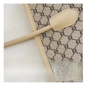 Detailed close-up of precise stitching and premium canvas texture on printed tote bag