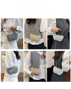 Close-up of sparkling evening clutch bags in various colors and metallic chain details