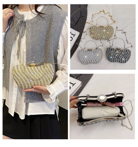 Detailed interior of rhinestone evening bag showing space for lipstick and umbrella
