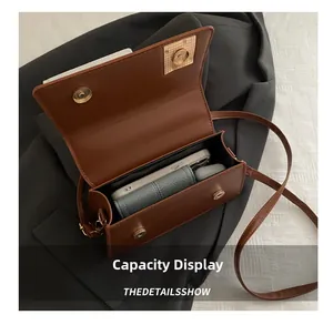 Interior view showing the large capacity of this brown square crossbody handbag