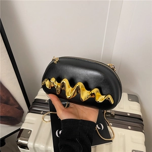 Chic black leather box bag with wave gold metal decor and elegant chain strap for evening