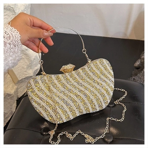 Sparkling rhinestone evening clutch with crystal lock, gold metal ring handle and chain strap