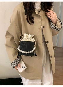 Retro black box bag with cream drawstring closure and white faux pearl decoration