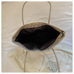 Top view showing spacious interior with brown lining and zipper of large tote bag