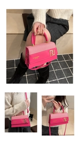Detailed views of the fuchsia square bag showing hand-carry and crossbody styling options