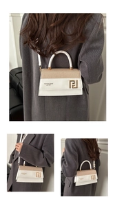 Detail showing the mixed beige woven fabric and white leather textures on a chic handbag