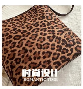 Detail of leopard print faux fur shoulder bag texture with premium leather strap