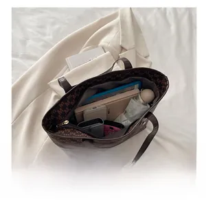 Interior view of large tote bag showing capacity for tablet, umbrella, and daily essentials