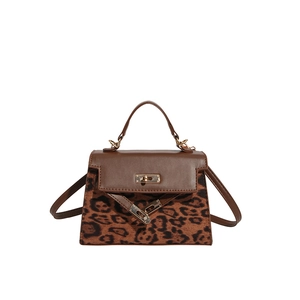 Vintage leopard print handbag with brown leather and gold metal twist lock closure