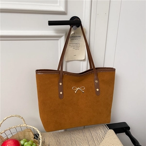 Retro brown large capacity tote bag in matte suede leather with golden bow accent