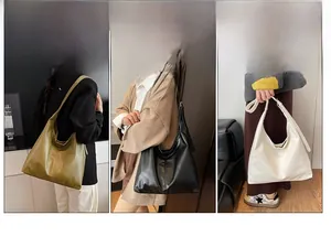 Trio of minimalist large leather hobo bags in olive, black and white with wide straps