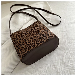 Close-up of leopard print bucket bag featuring premium matte texture and stitching details