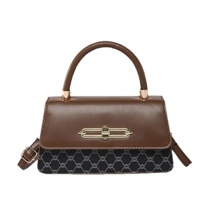 Retro patchwork crossbody bag with brown leather and dark canvas in a minimalist style