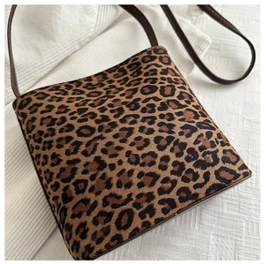 Detailed view of the leopard print crossbody bag with high-quality suede texture fabric