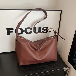 Minimalist brown large capacity crossbody tote bag with wide strap and gold zipper
